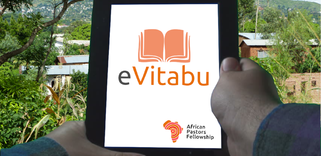 Hands holding a tablet.There's a white background showing an orange open book with the word "eVitabu".