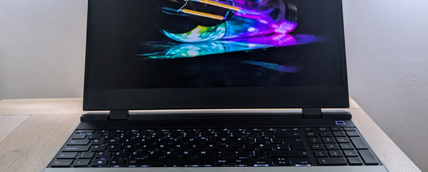 Cropped photo showing part of a laptop screen and part of its keyboard.  The laptop is on.
